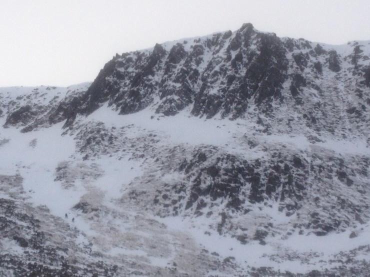 Two climbers heading up to the crags.