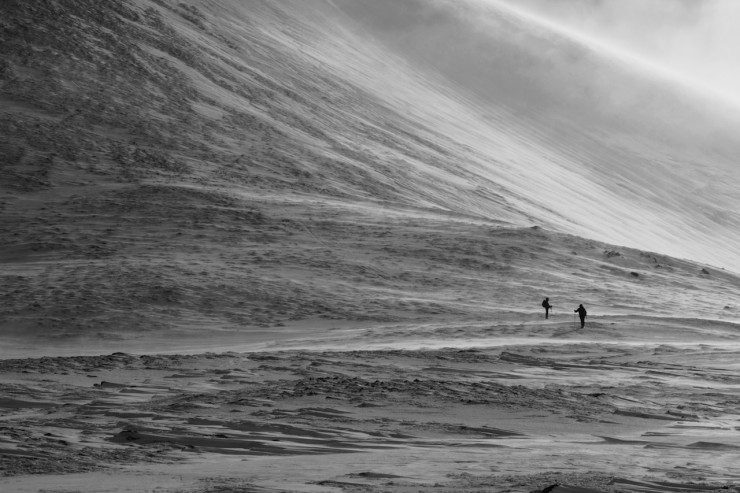 Walkers crossing a very windy col.