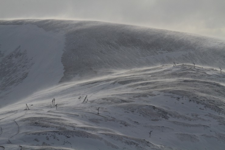 Very strong winds were redistributing snow and scouring open slopes. 
