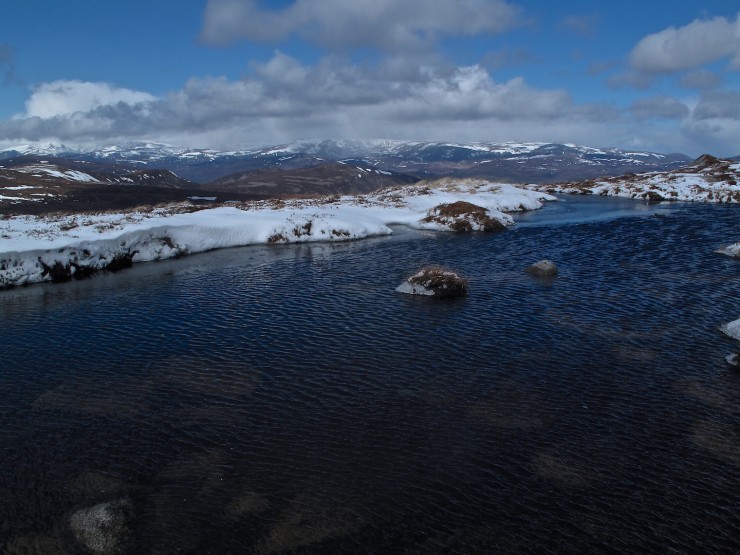 A bright and blustery day. 0  degrees at 950 metres, not enough to re-freeze this lochan.